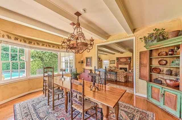 a view of a balcony with chair and a table