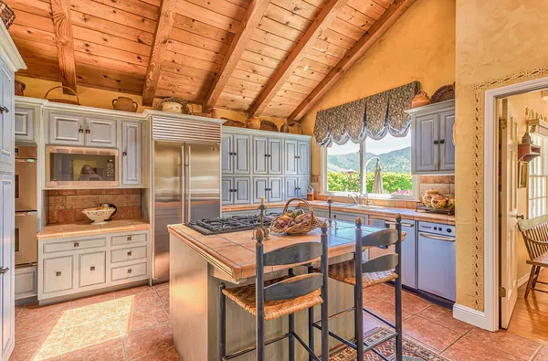 a living room with furniture windows and a fireplace