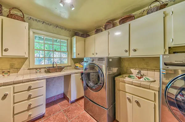 a aerial view of a house next to a city