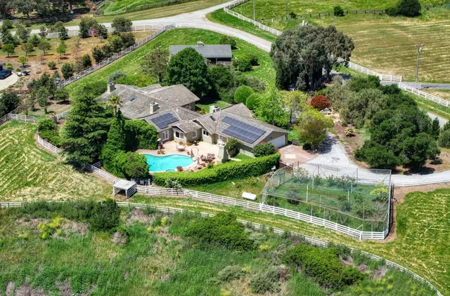 an aerial view of residential houses and outdoor space