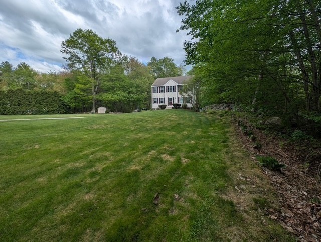 83 Haggerty Road Charlton, MA 01507 - Photo 32 of 32 a view of a tiny house with a yard