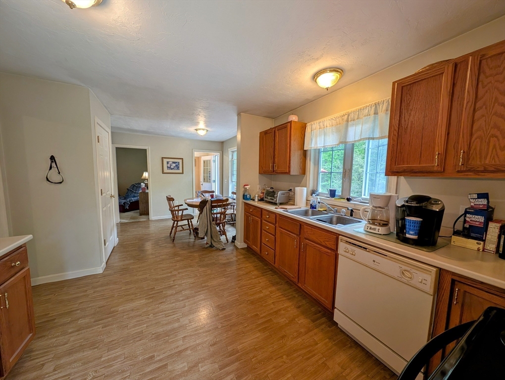 83 Haggerty Road Charlton, MA 01507 - Photo 10 of 32 a kitchen with stainless steel appliances granite countertop sink stove top oven and cabinets