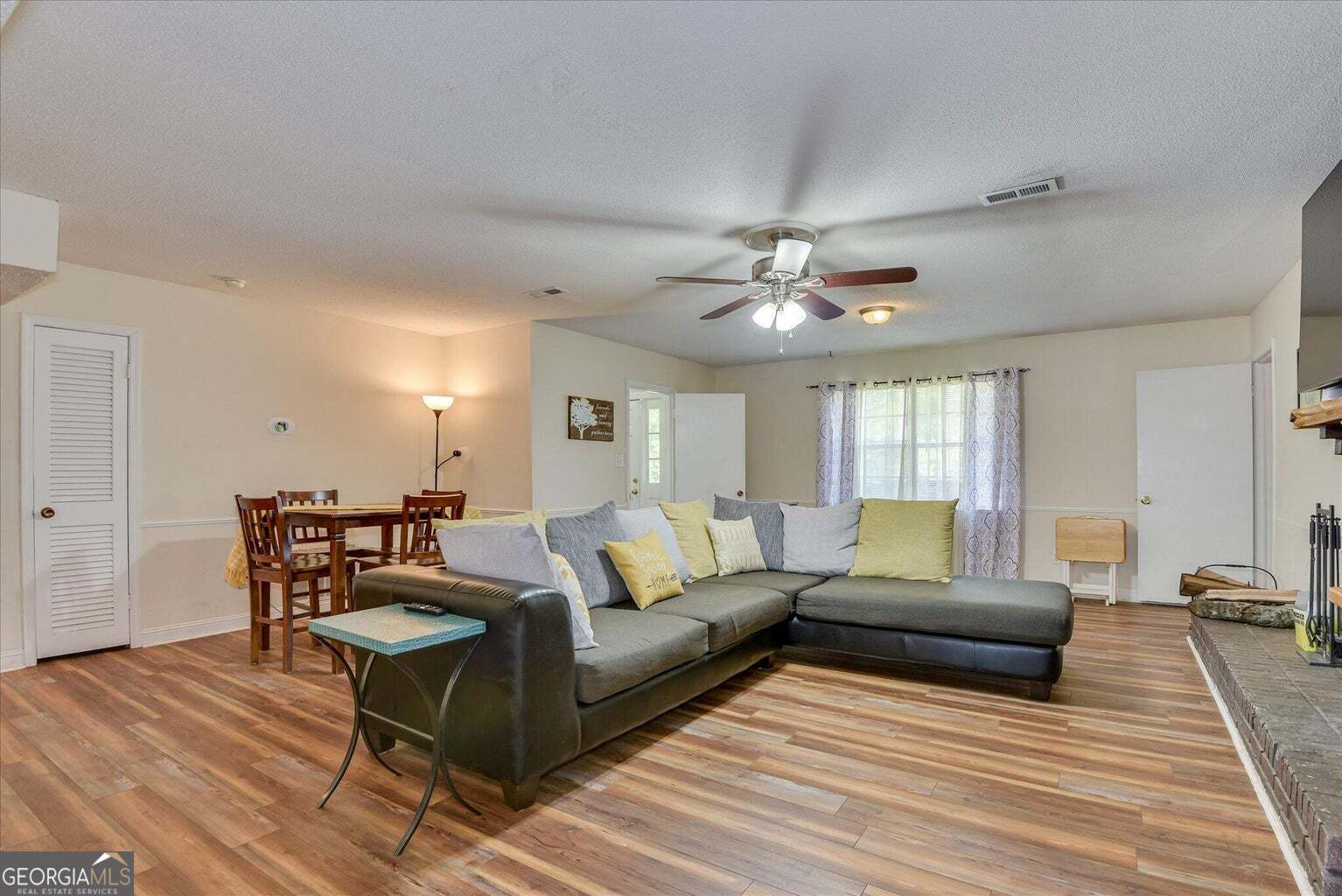 306 Pleasant Home Road Augusta, GA 30907 - Photo 11 of 57 a living room with furniture and a chandelier