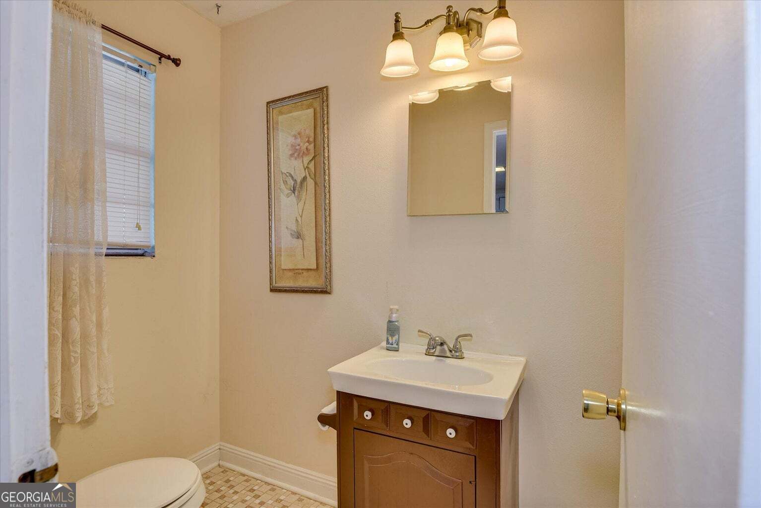 306 Pleasant Home Road Augusta, GA 30907 - Photo 13 of 57 a bathroom with a sink mirror and toilet
