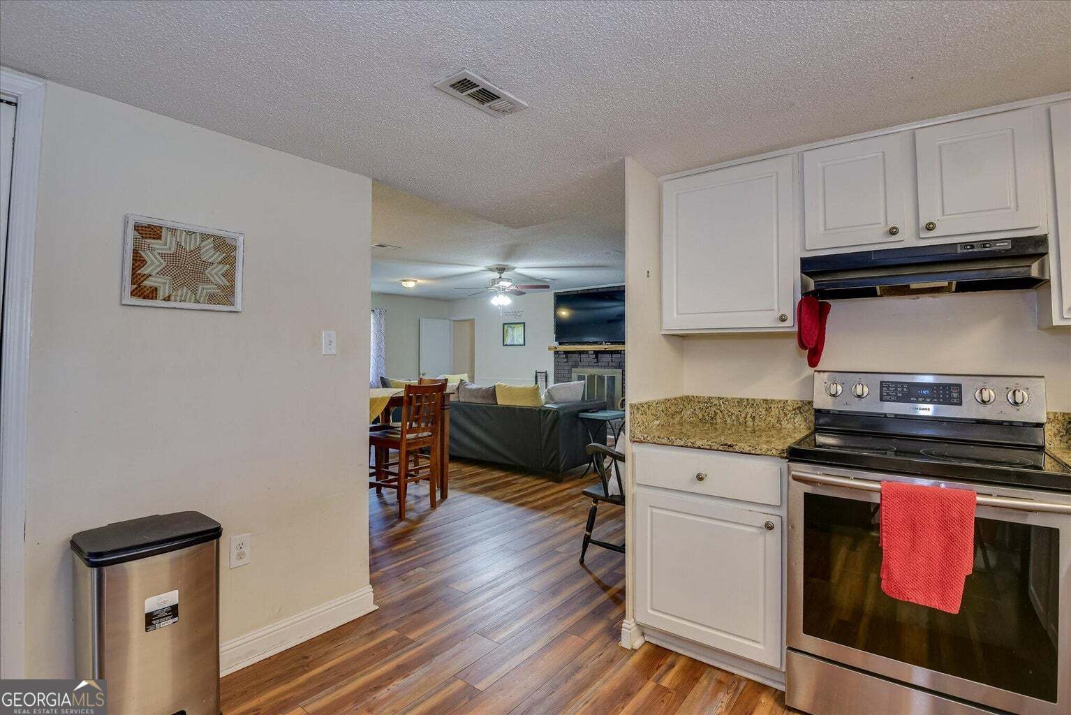 306 Pleasant Home Road Augusta, GA 30907 - Photo 18 of 57 a kitchen with a stove and a refrigerator