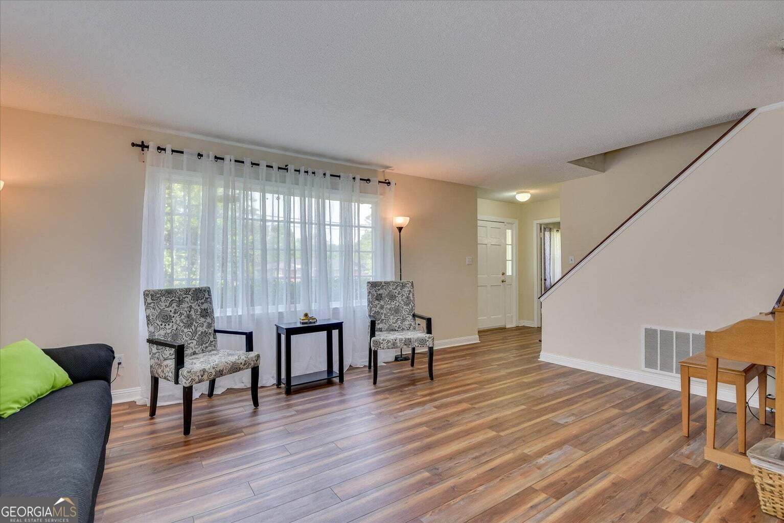 306 Pleasant Home Road Augusta, GA 30907 - Photo 25 of 57 a living room with furniture and wooden floor