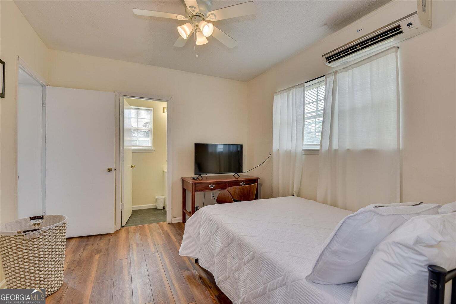 306 Pleasant Home Road Augusta, GA 30907 - Photo 27 of 57 a bedroom with a bed and a flat screen tv