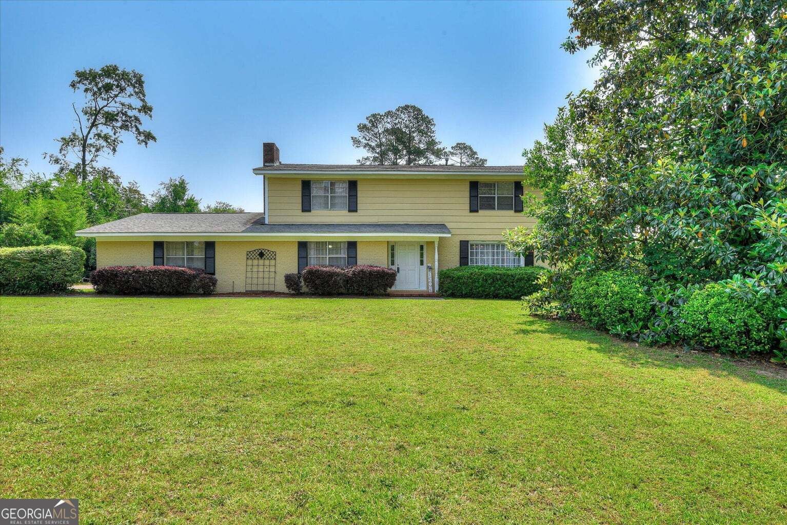 306 Pleasant Home Road Augusta, GA 30907 - Photo 3 of 57 a front view of a house with a garden