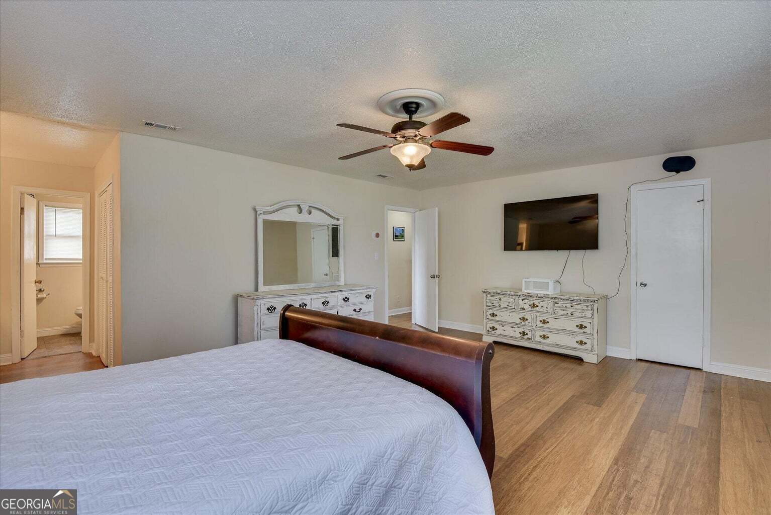 306 Pleasant Home Road Augusta, GA 30907 - Photo 39 of 57 a bedroom with a bed and a flat screen tv