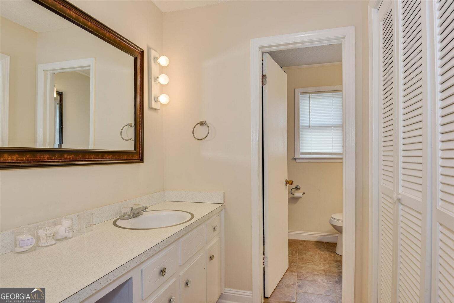 306 Pleasant Home Road Augusta, GA 30907 - Photo 40 of 57 a bathroom with a sink and a mirror