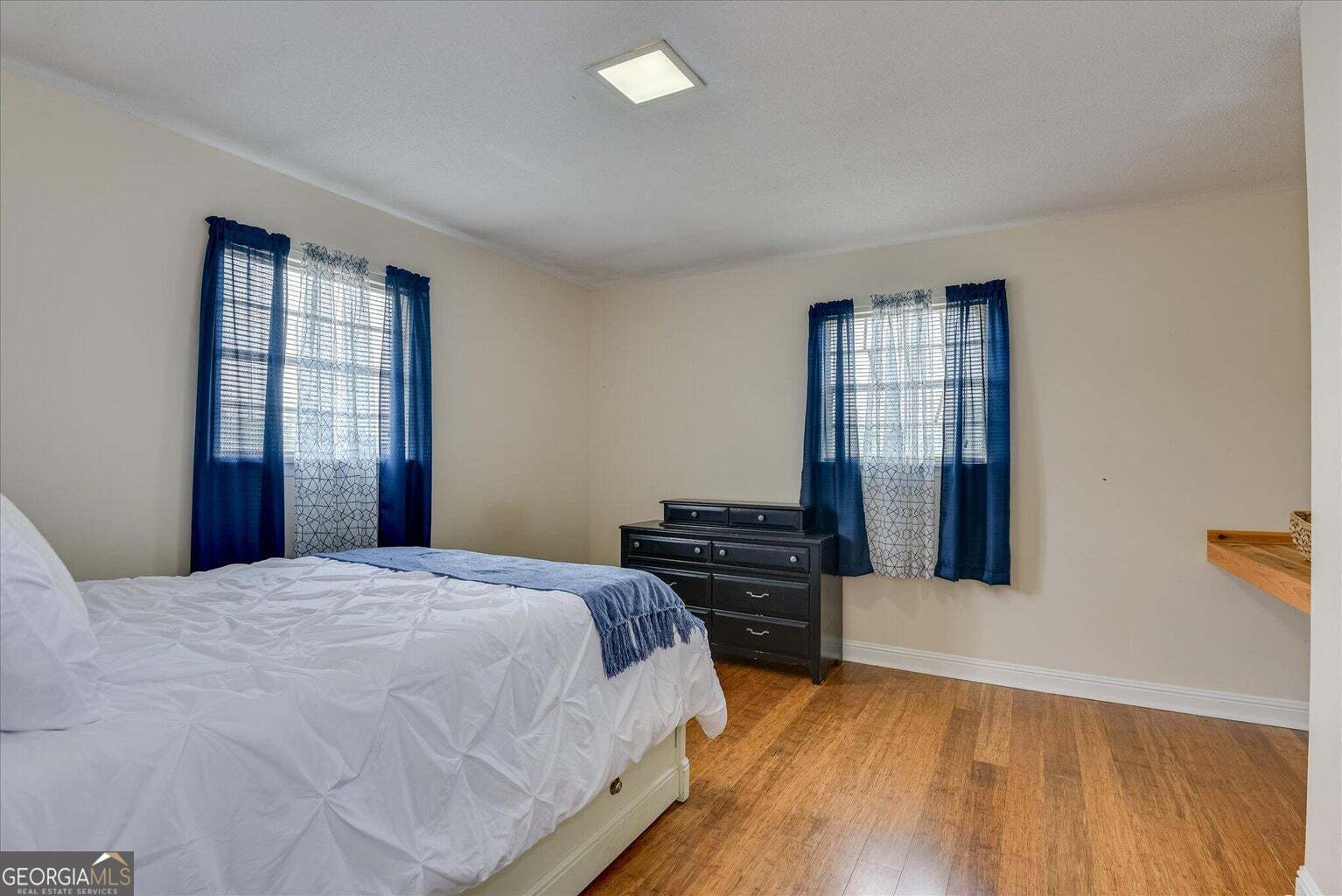 306 Pleasant Home Road Augusta, GA 30907 - Photo 46 of 57 a bedroom with a bed and wooden floor