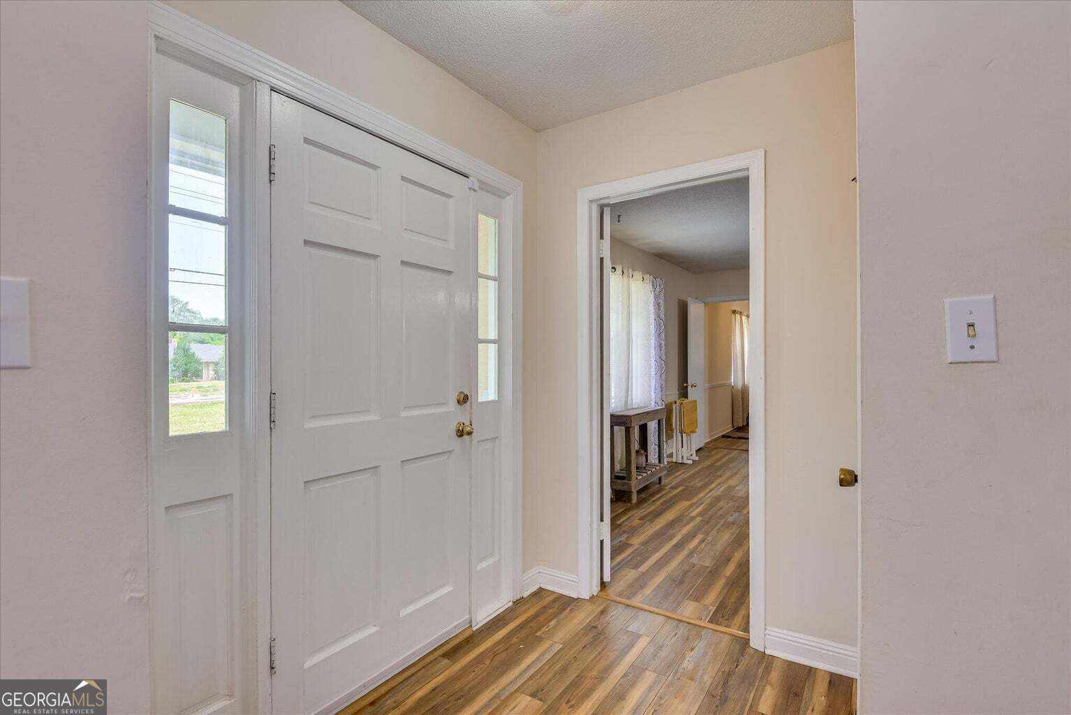 306 Pleasant Home Road Augusta, GA 30907 - Photo 6 of 57 a view of a hallway with wooden floor and a livingroom