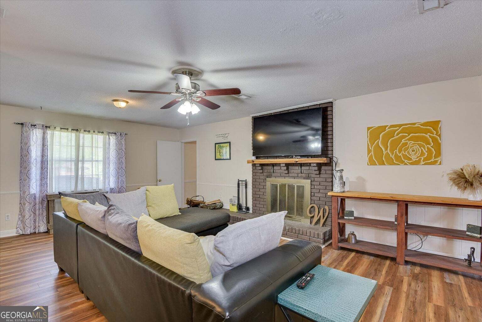 306 Pleasant Home Road Augusta, GA 30907 - Photo 10 of 57 a living room with furniture and a flat screen tv
