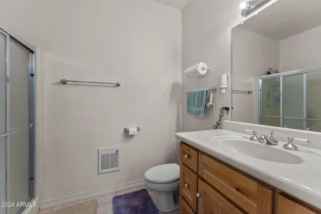 a bathroom with a sink and mirror