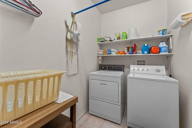 a bedroom with a bed and cabinet