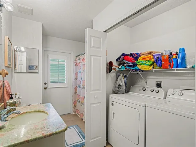 a front view of a house with a garden and yard