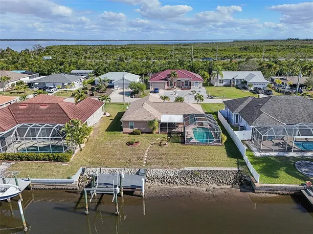 an aerial view of a house with a ocean view