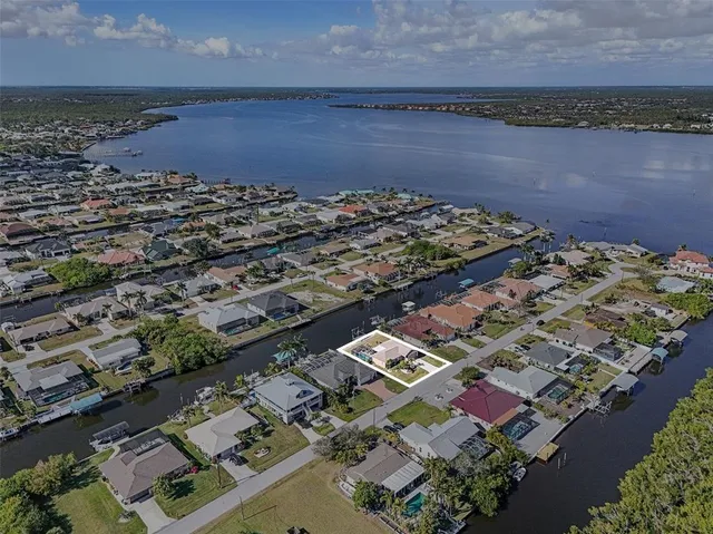 a view of a backyard with sitting area