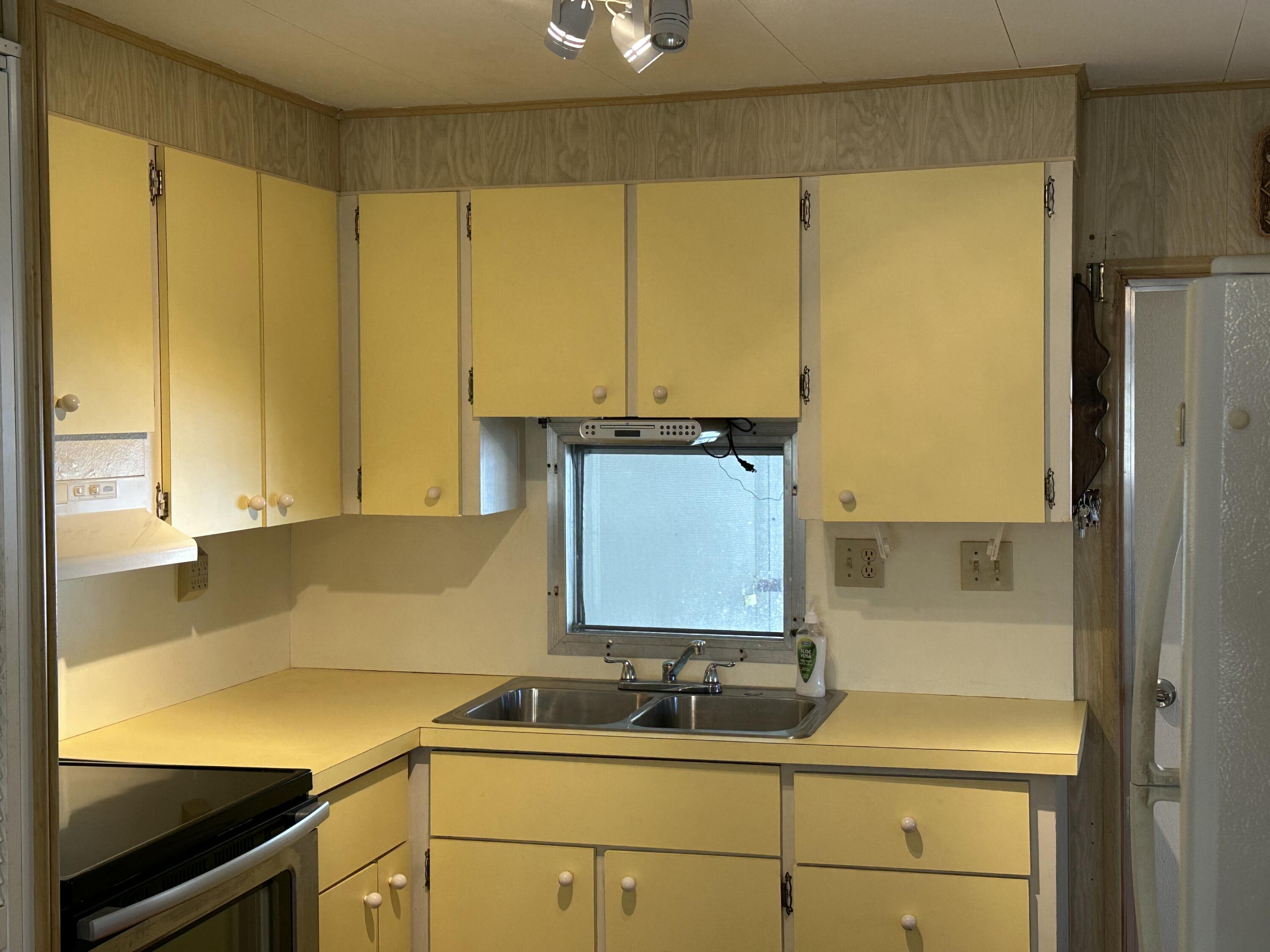 8435 East Club Road Boca Raton, FL 33433 - Photo 11 of 31 a bathroom with a sink and a mirror