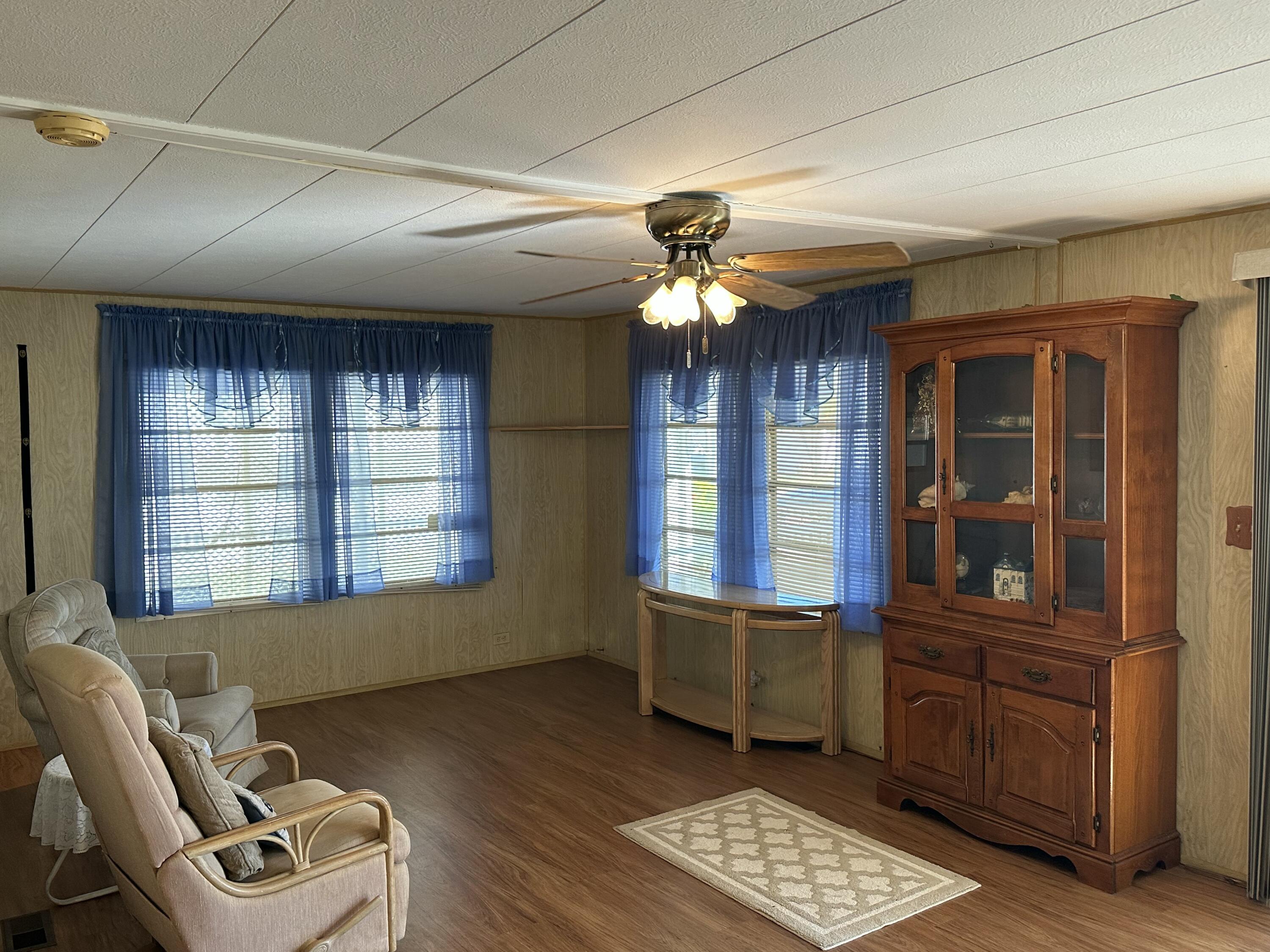 8435 East Club Road Boca Raton, FL 33433 - Photo 12 of 31 a view of a livingroom with furniture and windows