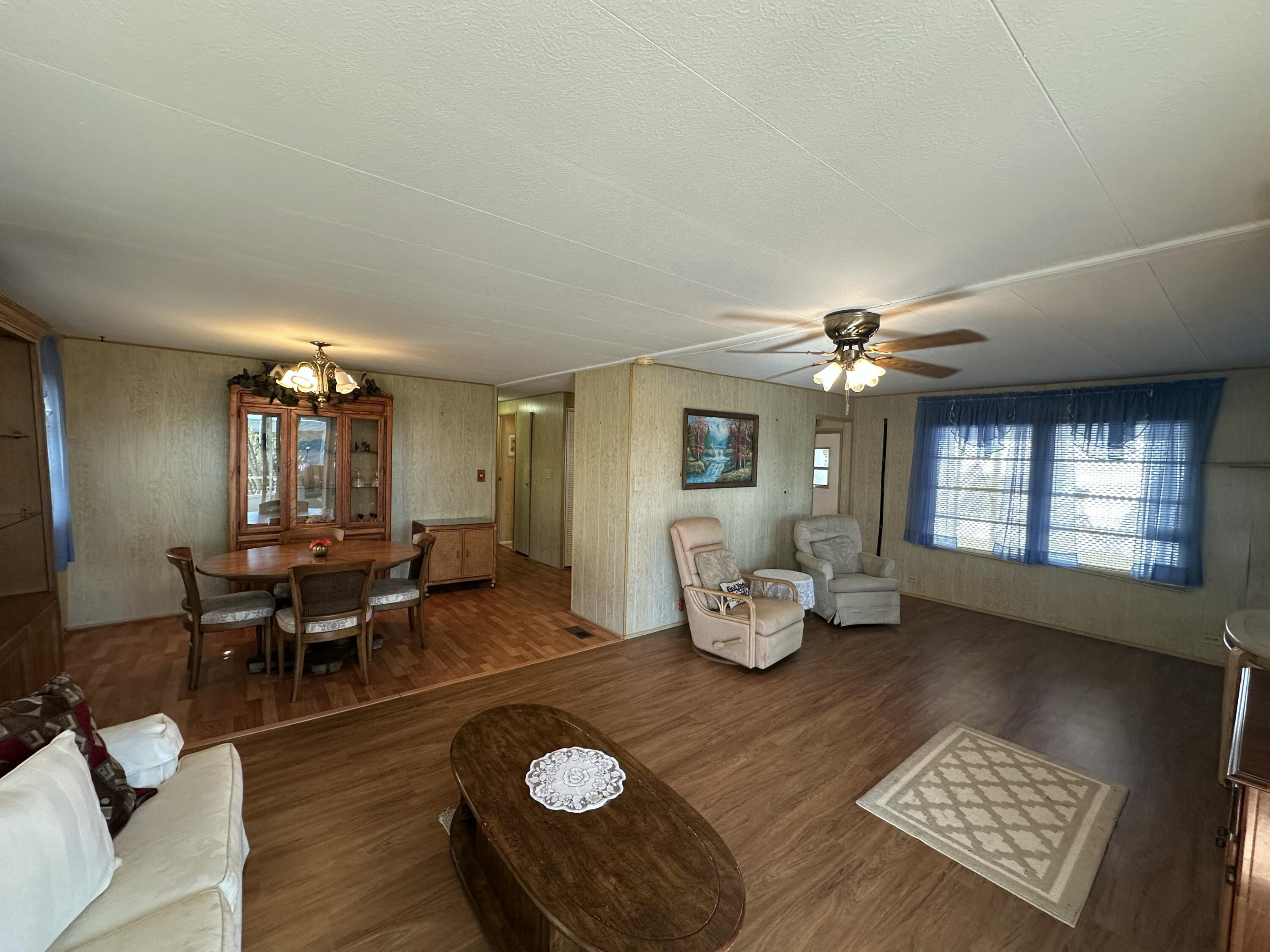 8435 East Club Road Boca Raton, FL 33433 - Photo 13 of 31 a living room with furniture and wooden floor