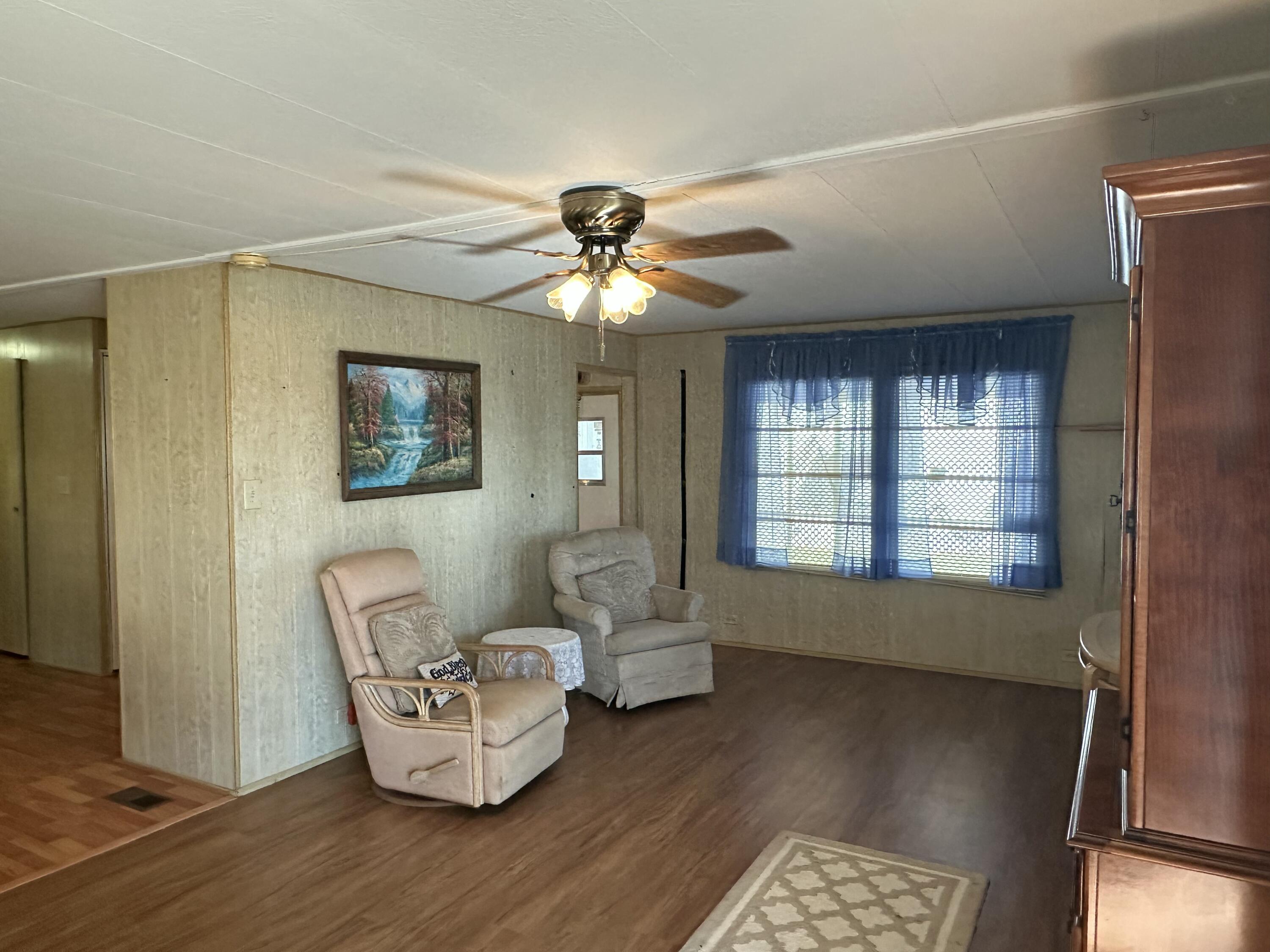 8435 East Club Road Boca Raton, FL 33433 - Photo 14 of 31 a living room with furniture and a window