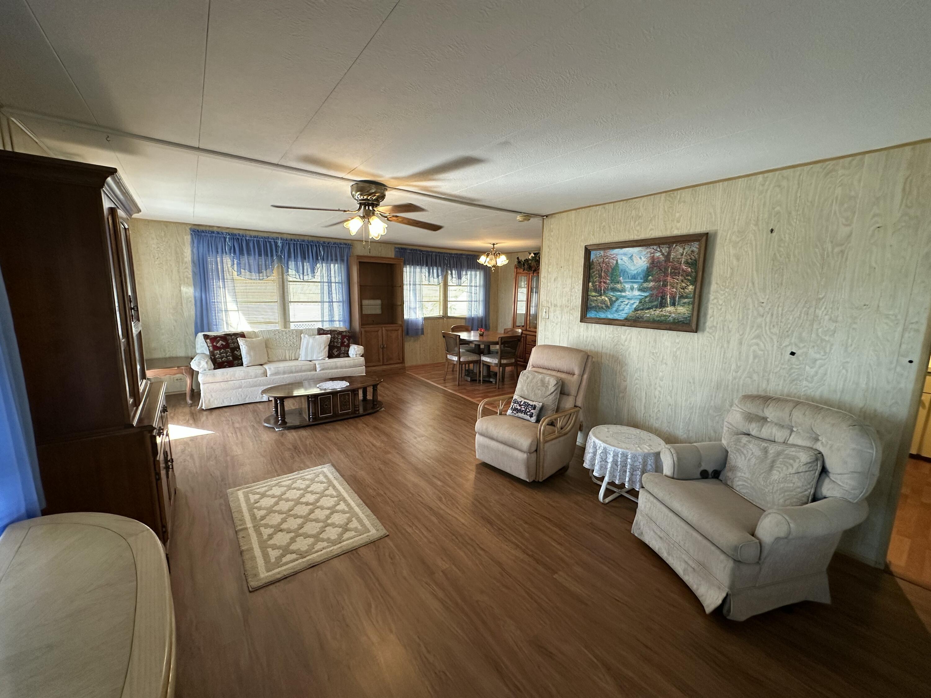 8435 East Club Road Boca Raton, FL 33433 - Photo 15 of 31 a living room with furniture and a flat screen tv