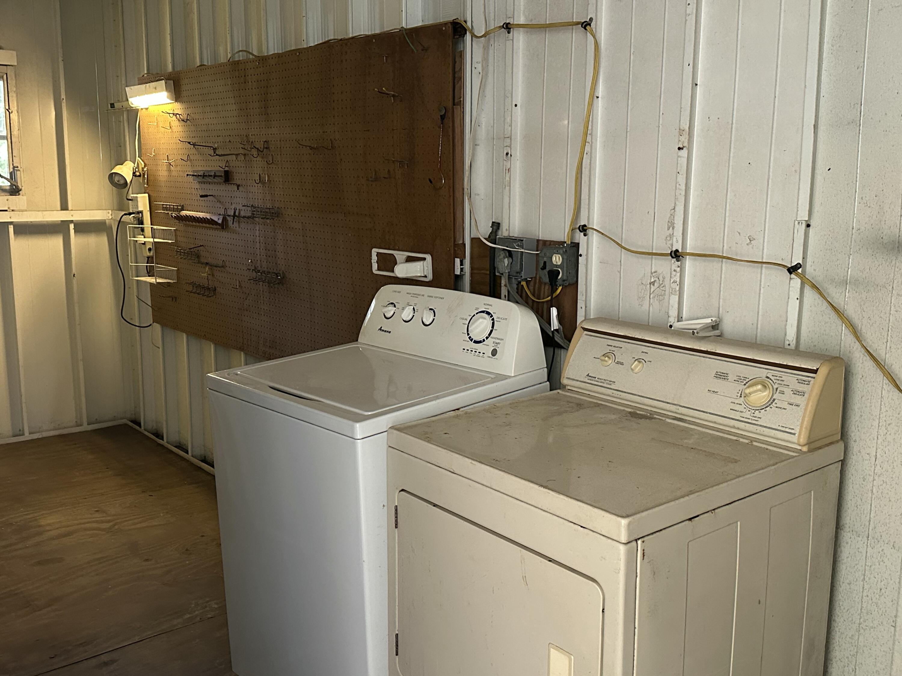 8435 East Club Road Boca Raton, FL 33433 - Photo 25 of 31 a utility room with dryer and washer