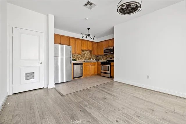 a view of a storage and utility room with washer and dryer