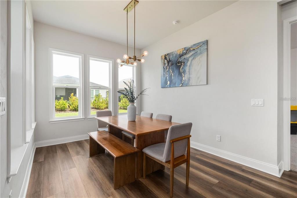 3225 Southwest 120th Terrace Gainesville, FL 32608 - Photo 11 of 42 a view of a dining room with furniture window and outside view