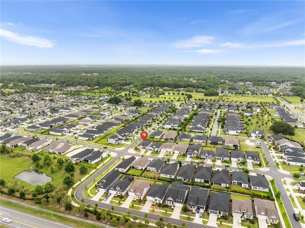 3225 Southwest 120th Terrace Gainesville, FL 32608 - Photo 28 of 42 an aerial view of residential building with parking space