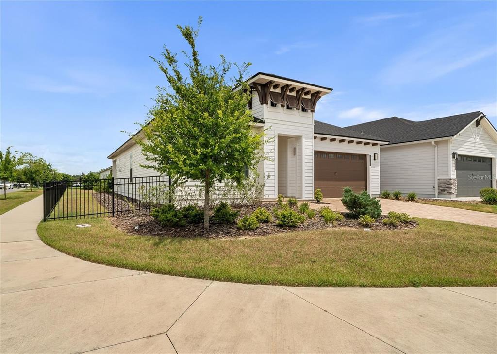 3225 Southwest 120th Terrace Gainesville, FL 32608 - Photo 31 of 42 a view of a house with a yard