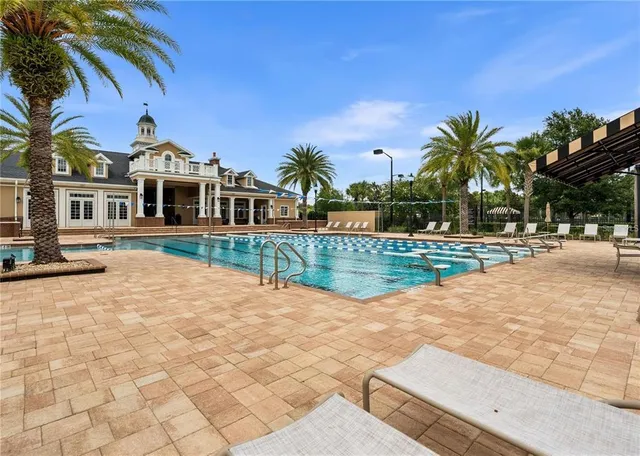 a view of a house with palm trees