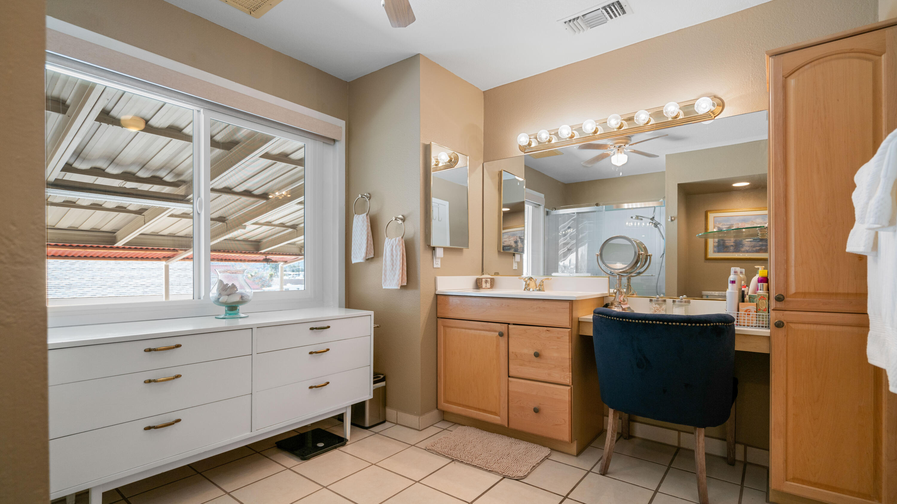 6913 Apache Trail Yucca Valley, CA 92284 - Photo 16 of 45 a kitchen with a cabinets and chairs