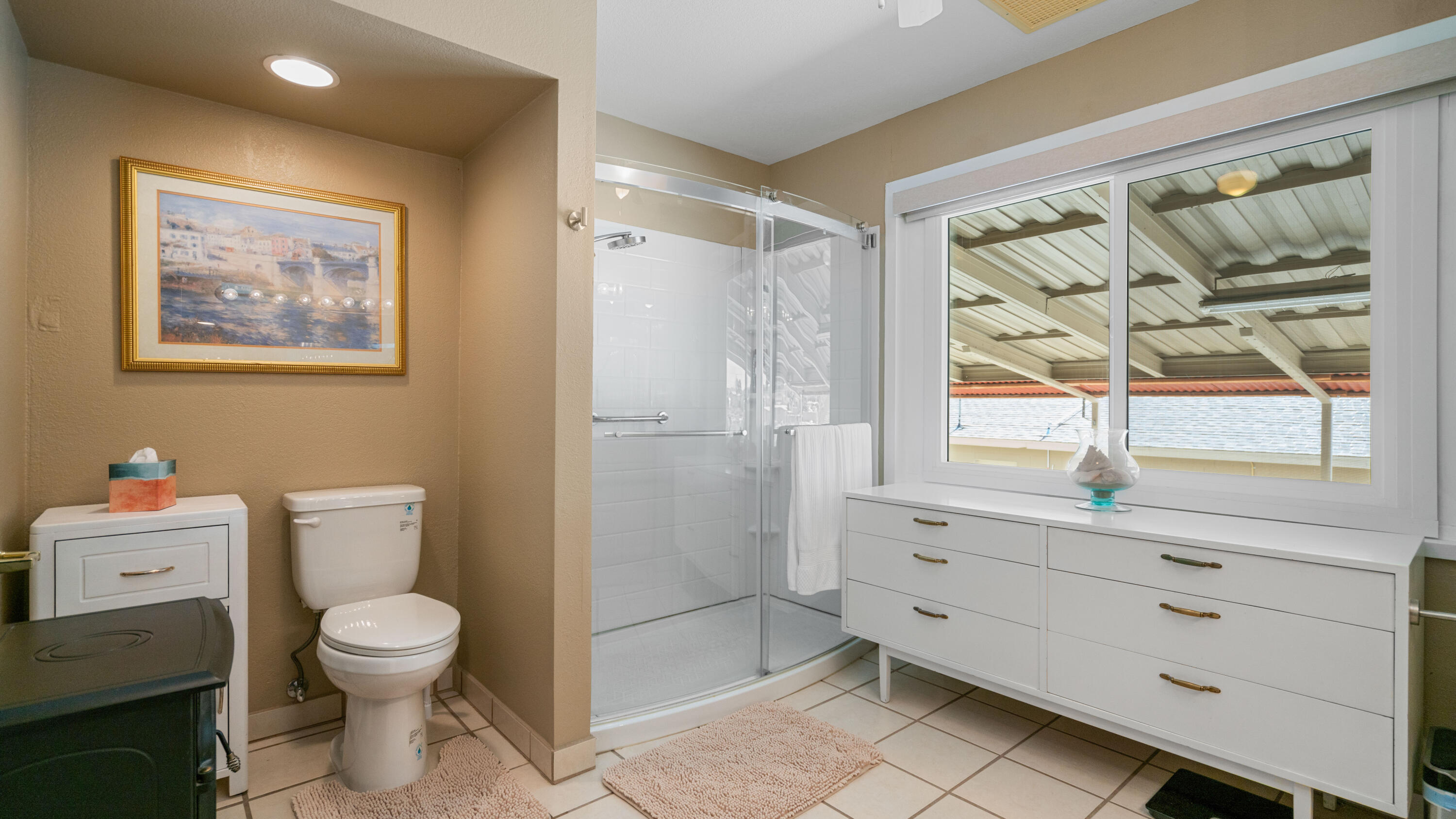 6913 Apache Trail Yucca Valley, CA 92284 - Photo 17 of 45 a bathroom with a toilet a sink and a shower