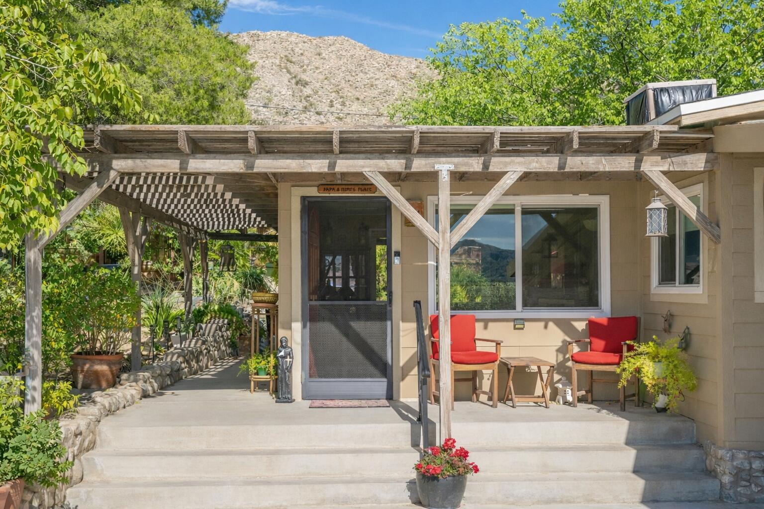 6913 Apache Trail Yucca Valley, CA 92284 - Photo 2 of 45 a view of a house with a porch