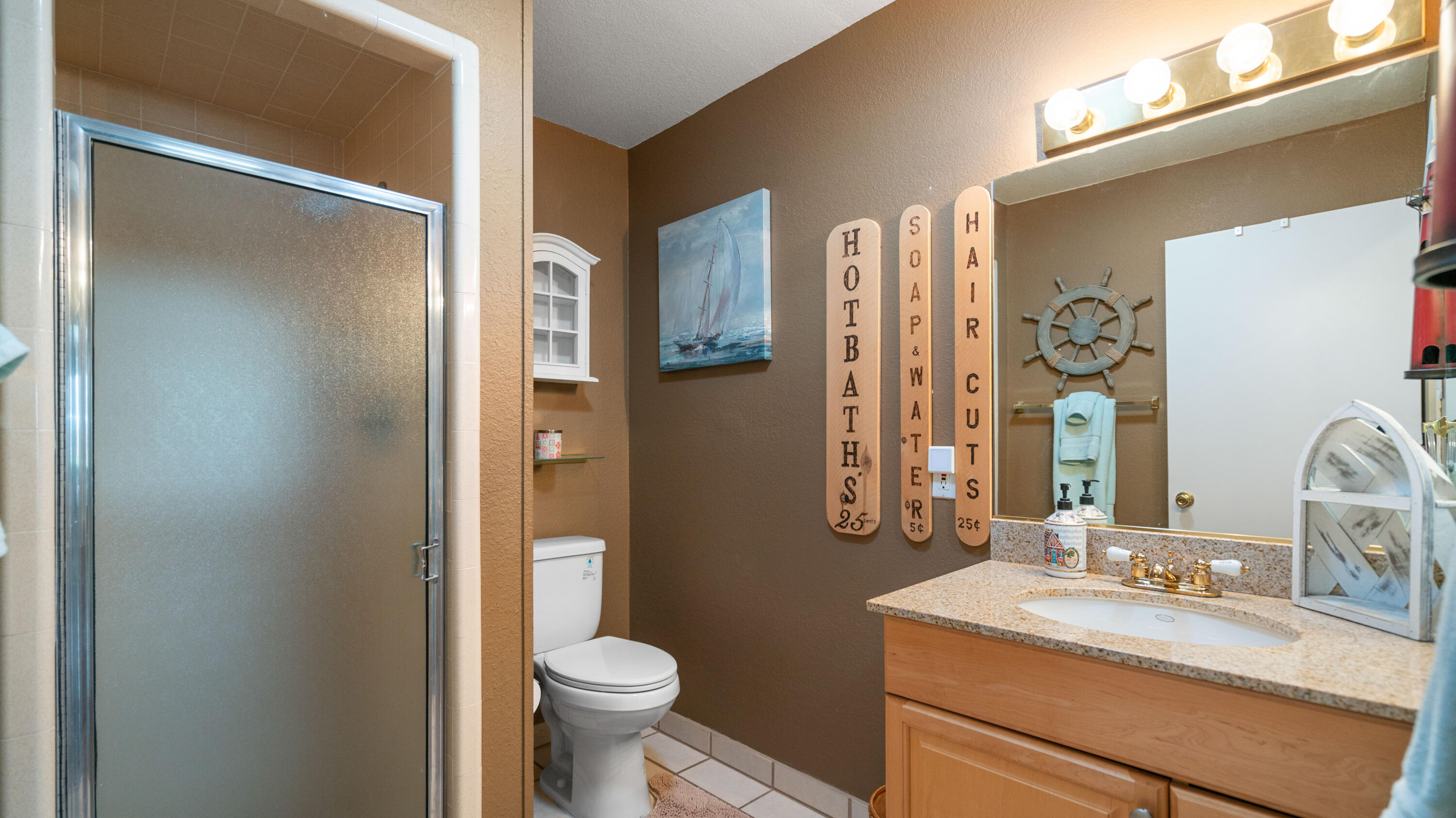 6913 Apache Trail Yucca Valley, CA 92284 - Photo 22 of 45 a bathroom with a granite countertop sink toilet and shower