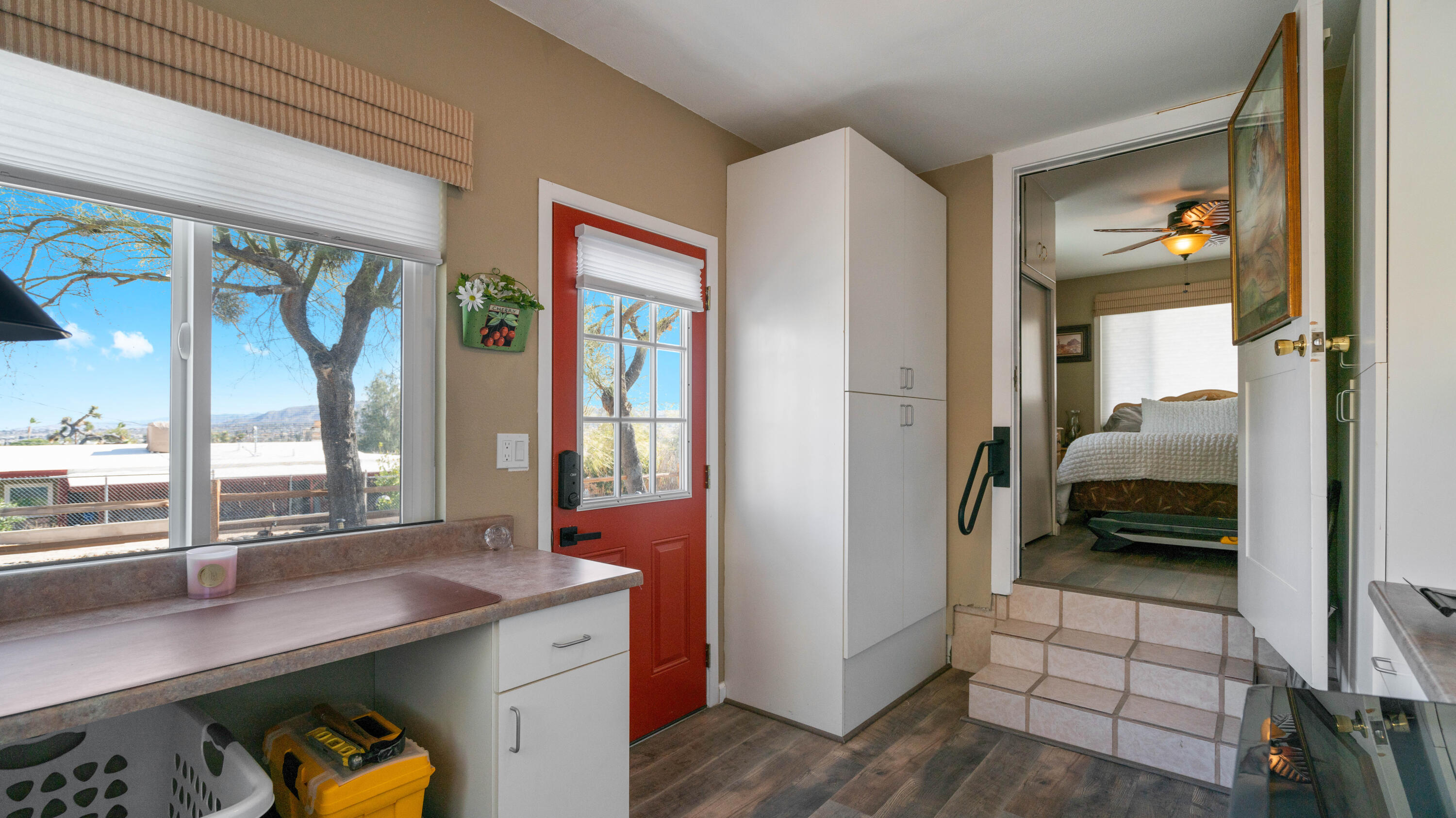 6913 Apache Trail Yucca Valley, CA 92284 - Photo 24 of 45 a en suite bathroom with a sink a large mirror and a shower