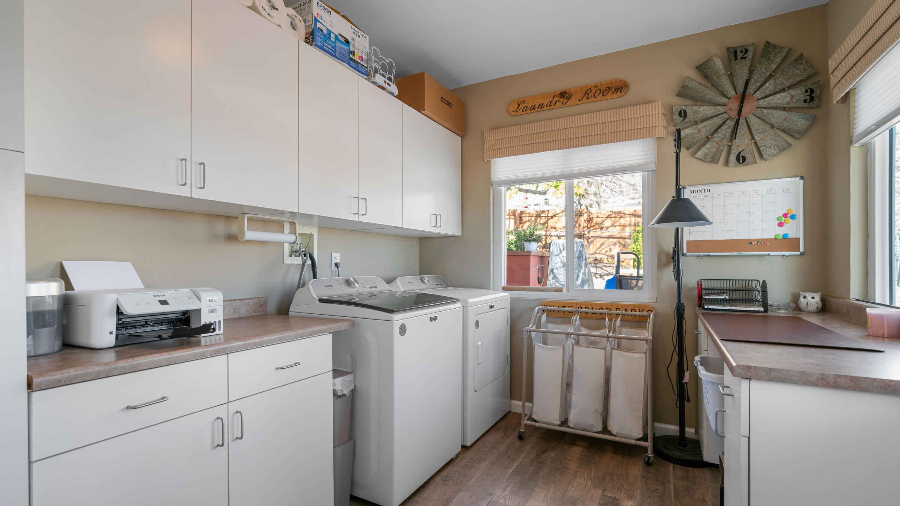 6913 Apache Trail Yucca Valley, CA 92284 - Photo 25 of 45 a kitchen with a sink cabinets stainless steel appliances and a window