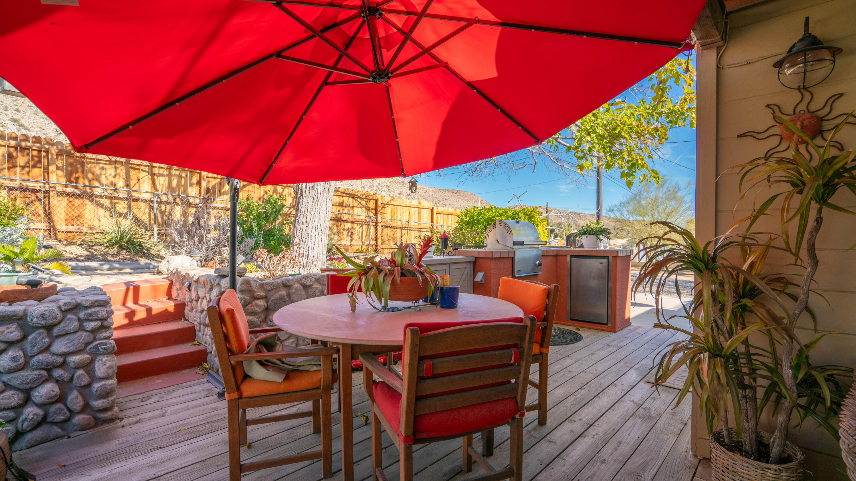 6913 Apache Trail Yucca Valley, CA 92284 - Photo 30 of 45 an outdoor space with furniture and umbrella