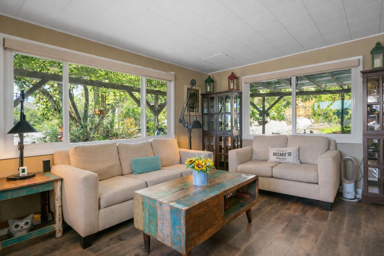 6913 Apache Trail Yucca Valley, CA 92284 - Photo 3 of 45 a living room with furniture and a large window