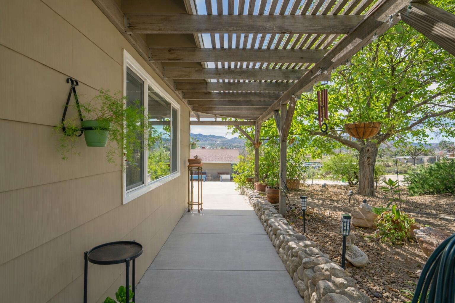 6913 Apache Trail Yucca Valley, CA 92284 - Photo 32 of 45 a view of a porch