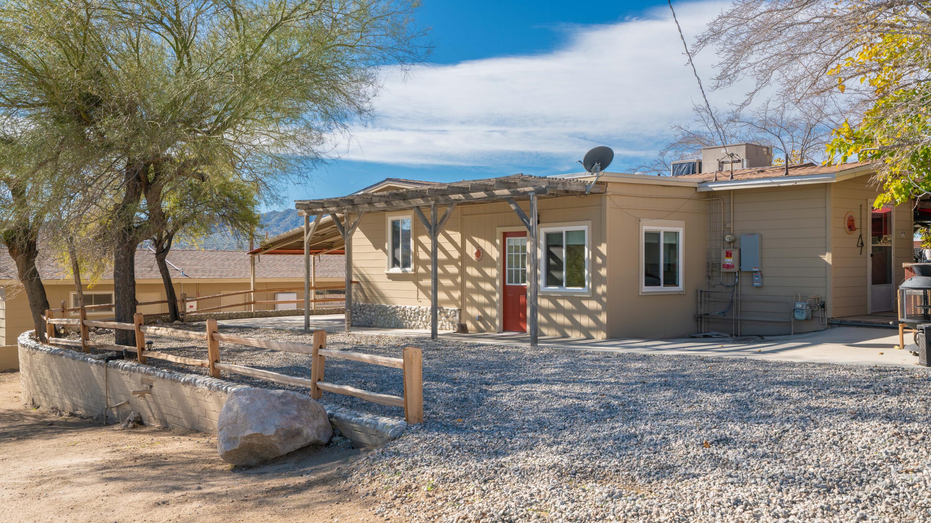 6913 Apache Trail Yucca Valley, CA 92284 - Photo 38 of 45 a view of a house with backyard and porch