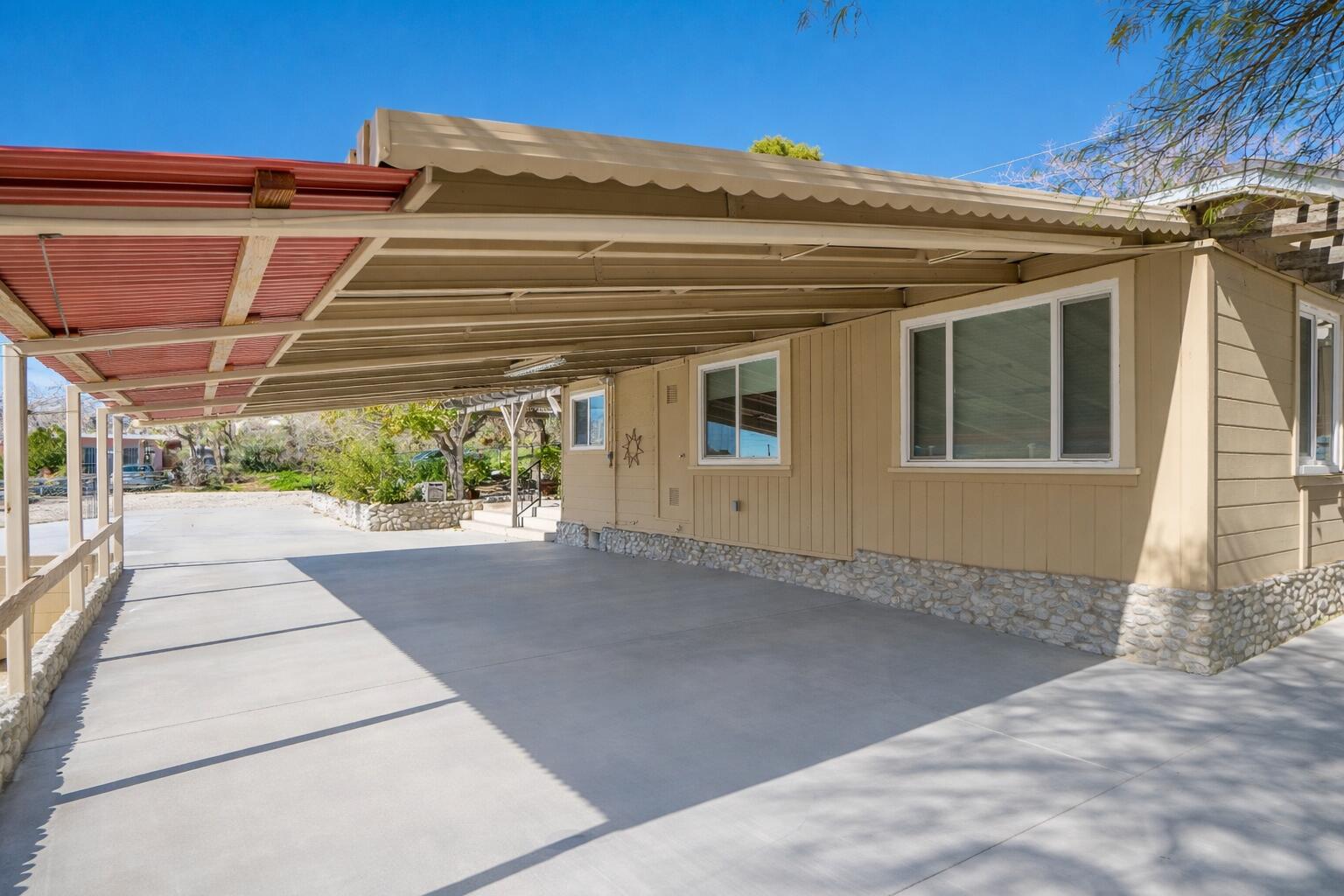 6913 Apache Trail Yucca Valley, CA 92284 - Photo 40 of 45 a view of a house with a street