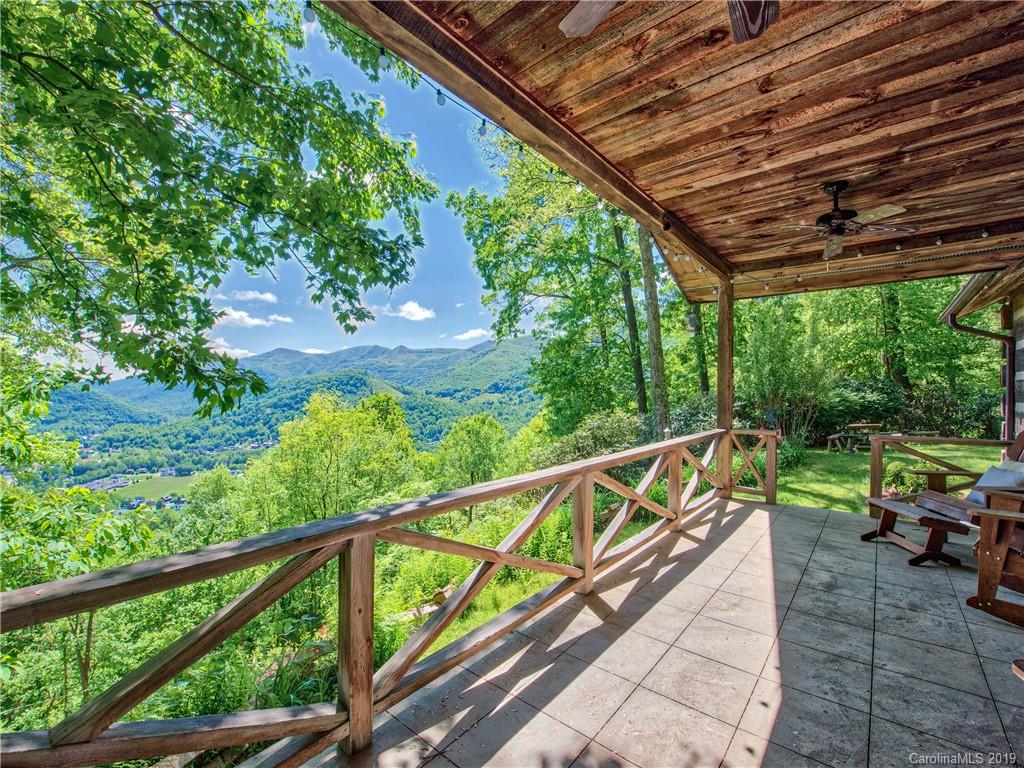 949 Setzercove Road Maggie Valley, NC 28751 - Photo 2 of 31 a view of two chairs in balcony
