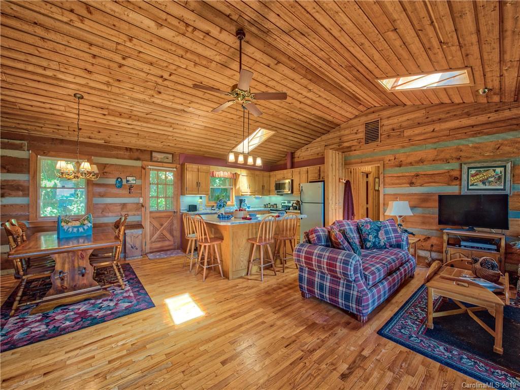 949 Setzercove Road Maggie Valley, NC 28751 - Photo 12 of 31 a outdoor space with patio lots of furniture