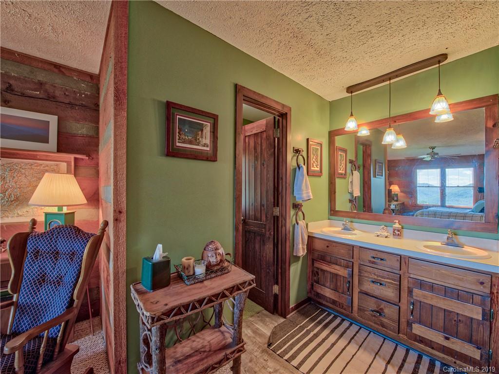 949 Setzercove Road Maggie Valley, NC 28751 - Photo 24 of 31 a room with furniture and a sink