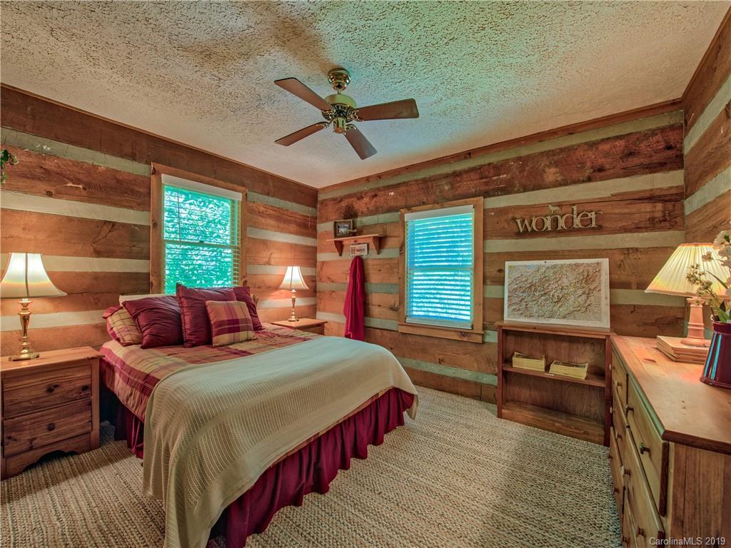 949 Setzercove Road Maggie Valley, NC 28751 - Photo 25 of 31 a bedroom with double bed and a window
