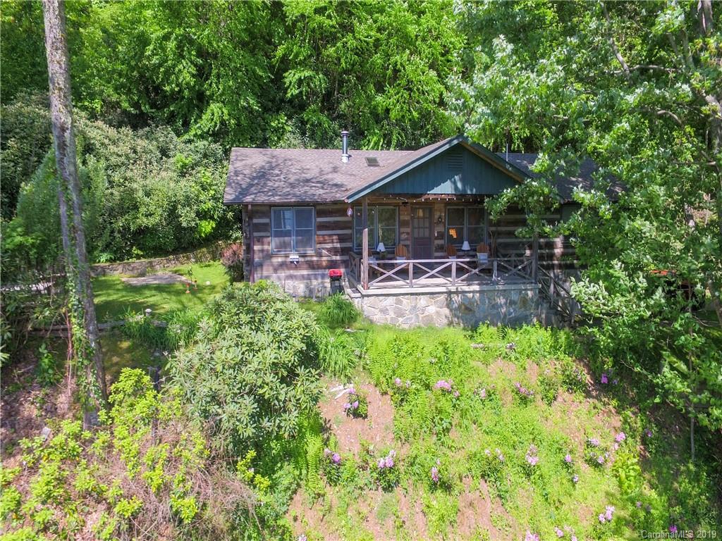 949 Setzercove Road Maggie Valley, NC 28751 - Photo 4 of 31 an aerial view of a house with yard and lake view