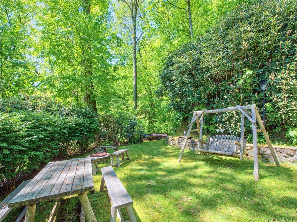 949 Setzercove Road Maggie Valley, NC 28751 - Photo 10 of 31 a view of backyard with a table and chairs